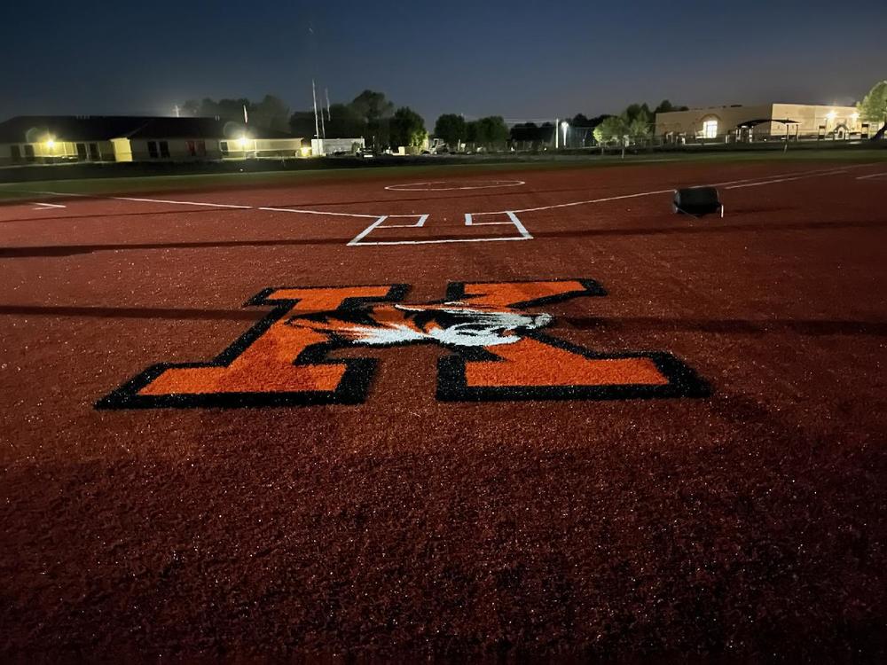 Softball field with our logo at the bottom